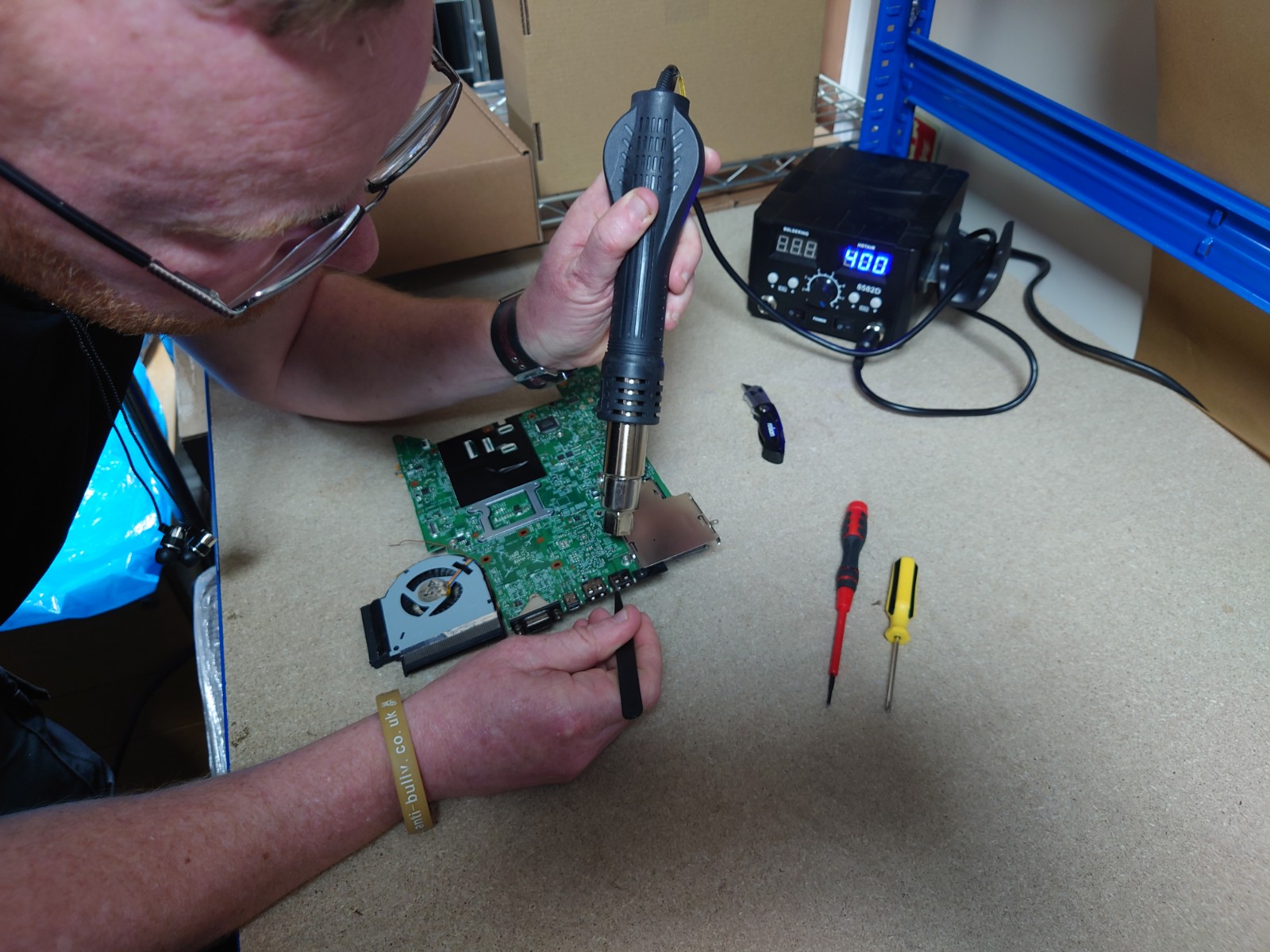 Technician working on circuit board