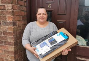 Woman holding a brand new laptop