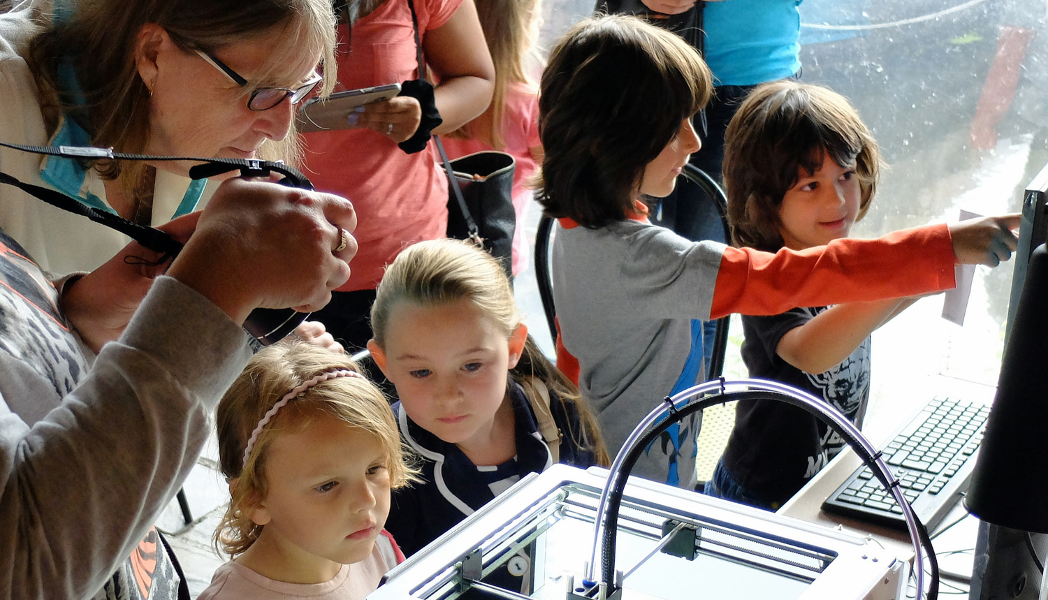 Children and adults interacting with technology