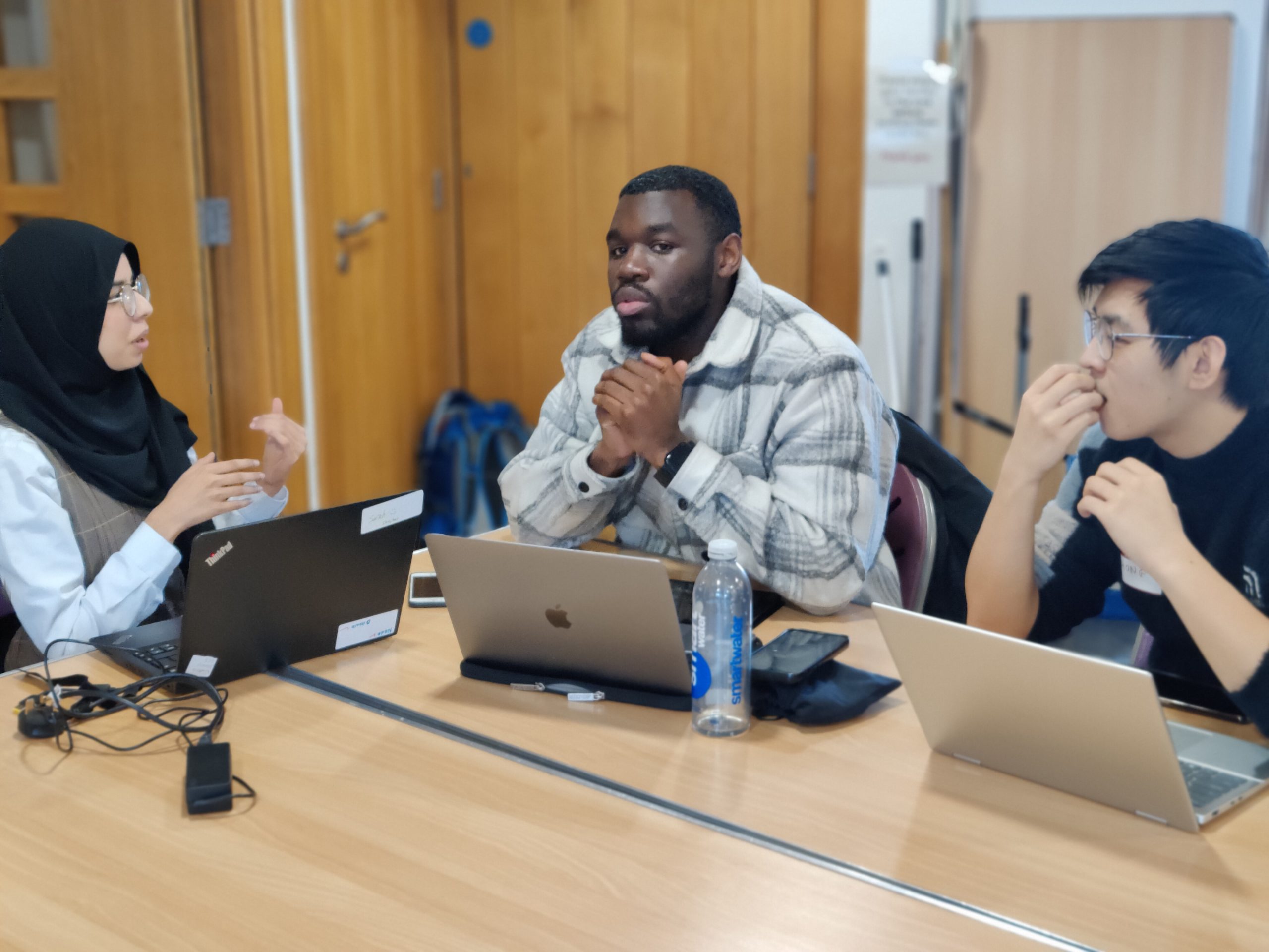 Young adults with laptops