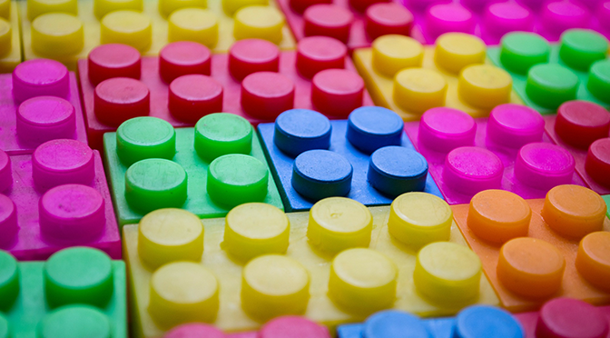 Colourful childrens' building blocks laid out together