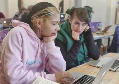 Two young people with laptops