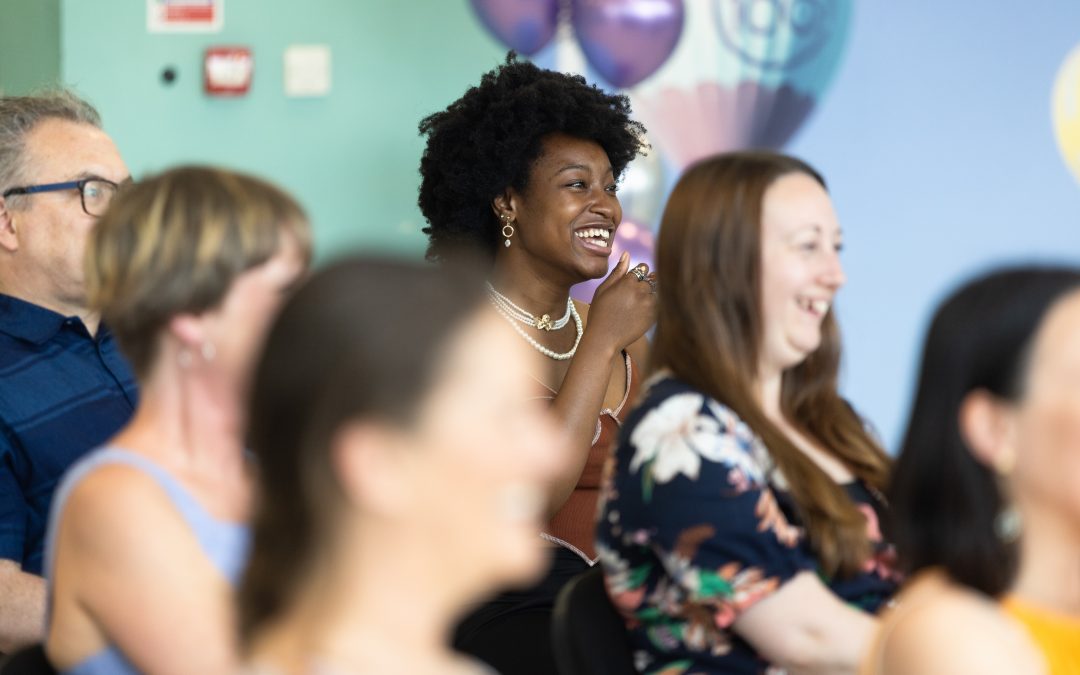 People in soft focus in an audience