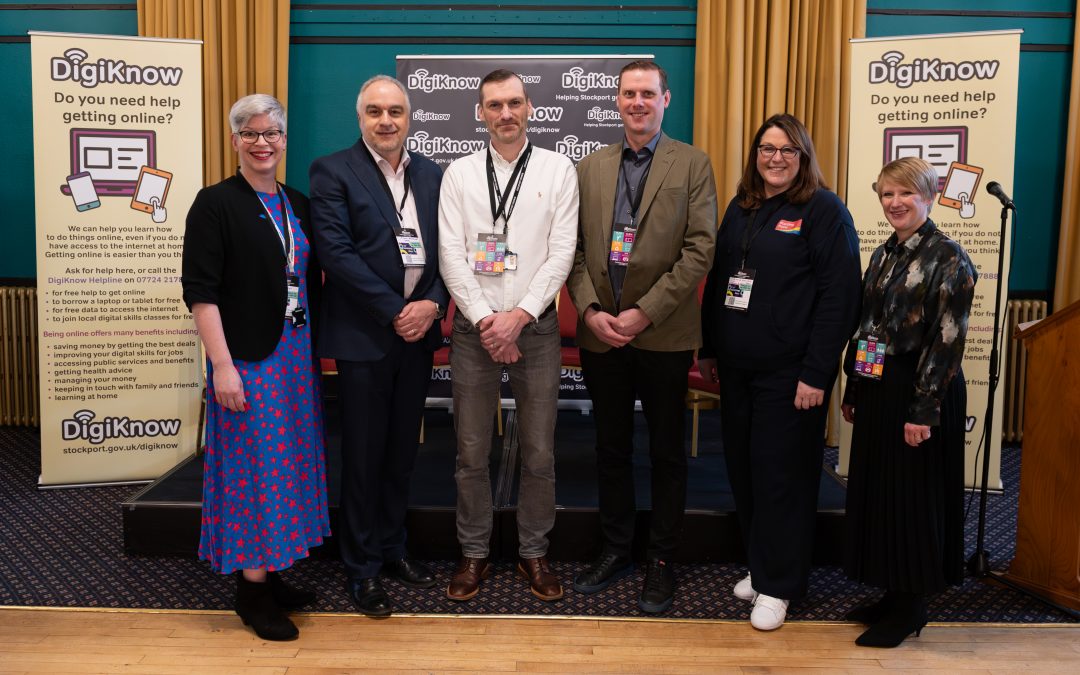 A group of presenters on a stage