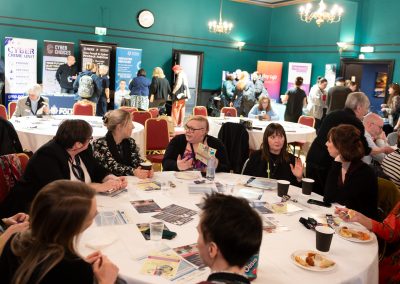 People attending a seminar sat around a table